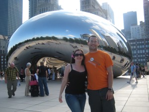Becky and Jonathan enjoy the Chicago skyline and a giant metallic bean!